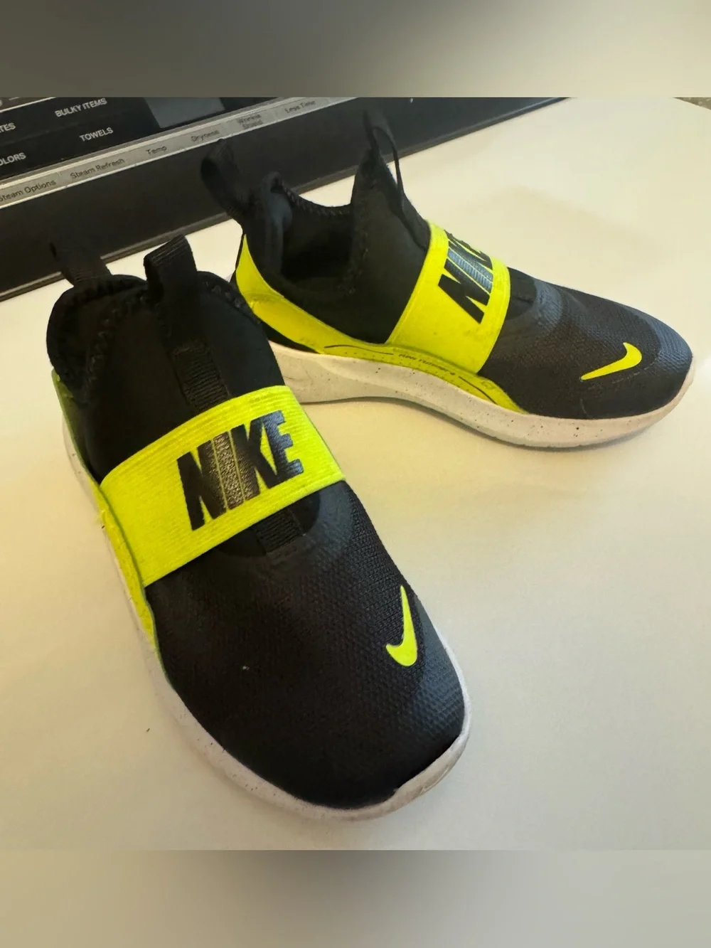 Nike Kids Slip-On Sneakers in Black and Volt